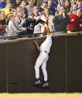 Moises Alou reaches for the foul ball as Steve Bartman deflects it